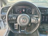 the interior of a car with a steering wheel and dashboard controls