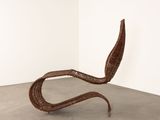 an image of a chair made out of wickers in a room