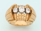 an image of a gold ring with three diamonds on it