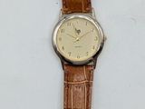 a watch that is sitting on a white surface