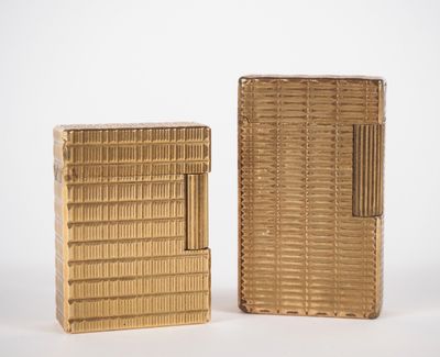 pair of gold cigarette cases, one with a lighter and the other with a lighter