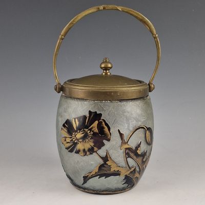a vase with a handle that has a design on it