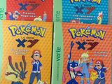 three books of pokemon books on a table with a white background