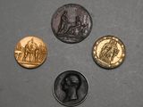 four different types of coins are shown on a gray surface