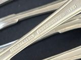a lot of spoons that are sitting on a table