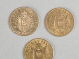 three gold coins with a coat of arms on them