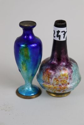 two vases sitting next to each other on a table