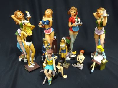 many figurines of different types of women on a black background