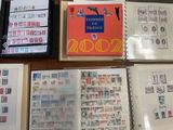 many different types of stamps on the pages of a book