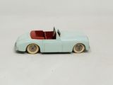 a toy car that is sitting on a white surface