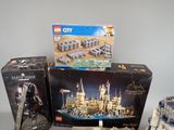 three lego city sets are sitting on a table next to each other