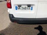 a white van parked on the side of the road