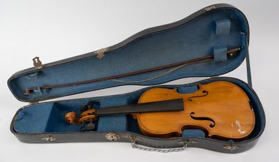an old violin case with a violin in it on a white surface