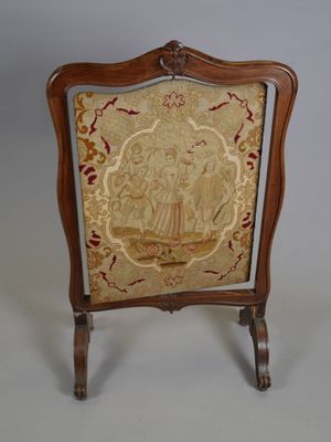 an old chair with a gold and red design on the back