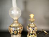 two vases that are sitting on a table