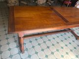 a table that has a wooden top and a wooden base