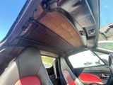 a view of the inside of a car from the driver ' s seat