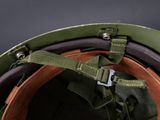 an old military helmet with a metal buckle on the side of it