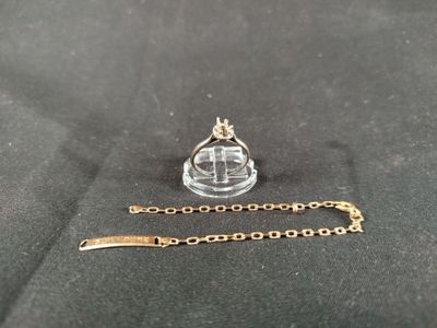 a gold chain with a crown on top of it