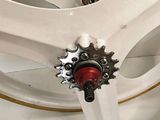 a close up of a bicycle wheel with a sprocket attached to it
