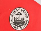 the back of a red and white soccer jersey with a black and white logo