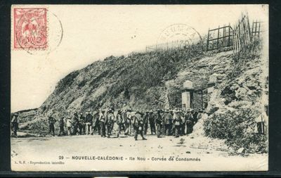 an old photo of a group of men standing in front of a mountain
