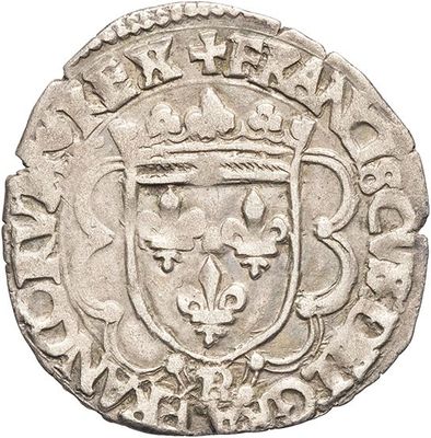 a silver coin with a coat of arms on it