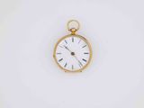 an old gold pocket watch with roman numerals and roman numerals on the face