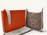 an orange and grey bag with a peace sign on it