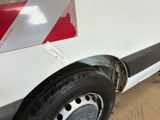 a white van with a red stripe on the side of it