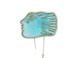 turquoise and gold fish head pin with hair pins on a white background