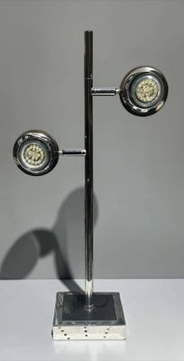 a lamp that is sitting on a stand on a table