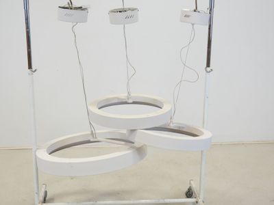 a white table with three lights on it