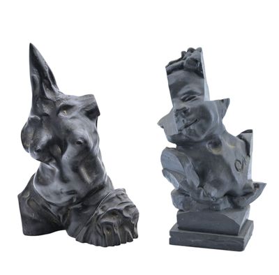 two statues of a dog and a cat on a white background