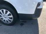 a close up of a white car with black rims