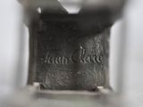a close up of a metal object with writing on it
