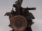 a small machine that is sitting on a white surface