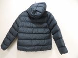 an image of a jacket hanging on a wall with a white background