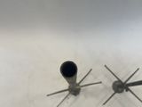 a pair of stainless steel pipe holders on a white surface