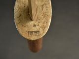 a close up of a wooden spoon with a wooden handle