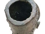 an image of a bronze vase with a cat on it