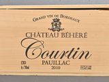 a wooden box with a wine bottle inside of it