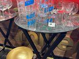 a lot of empty wine glasses on a table