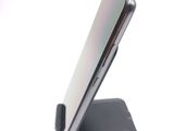a close up of a cell phone on a stand