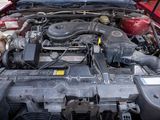 a picture of a car engine with its hood open