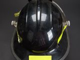 an image of a fireman ' s helmet on a black background