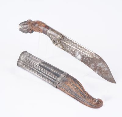 two different types of knives on display on a white surface