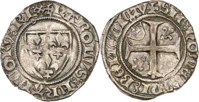 a silver coin with a cross on the front and a shield on the back