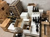 many bottles of wine sitting on a table in a room