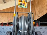 an image of a garden hose cart in a store